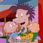 a cartoon of a man holding two babies with the words `` stunning '' written on it .