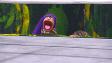 a puppet with purple hair and a pink tongue