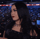 a woman wearing red lipstick and a necklace that says d1