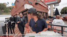 a group of men standing outside a burger king restaurant