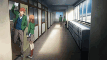 a boy and a girl are standing in a hallway with lockers on the wall