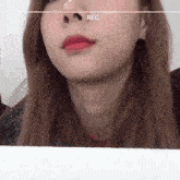 a close up of a woman 's face with red lipstick and a record label .
