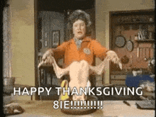 a woman is holding a turkey in her hands and says `` happy thanksgiving 81e ! ''