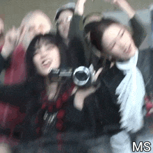 a blurry photo of a group of people with ms written on the bottom