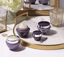 three bottles of anew platinum cream on a tray