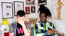 a man wearing a shirt that says w on it
