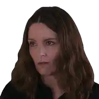 a woman with long brown hair looks up at something