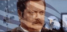 a man with a mustache is standing in front of an american flag with an eagle behind him .
