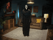 a person dressed in a grim reaper costume is standing in a living room