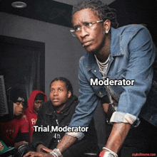 a man in a denim jacket is looking at a computer screen with the words " moderator " and " trial moderator " below him