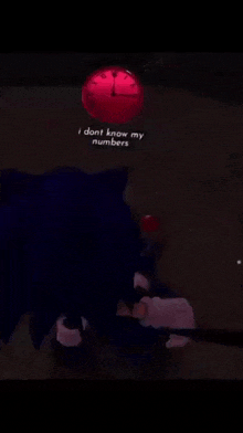 sonic the hedgehog laying on the ground with a red clock above him that says i dont know my numbers