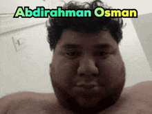 a picture of a man with the name abdirahman osman written above him