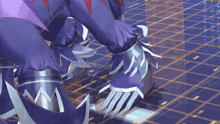 a close up of a person 's feet with purple and silver armor