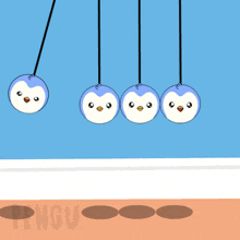 four penguins are hanging from a string and the word penguin is on the bottom