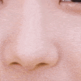 a close up of a woman 's face with a pink lip and white teeth