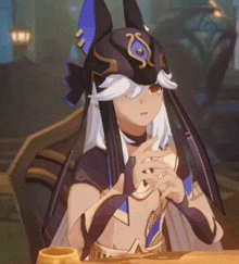 a cartoon character is sitting at a table with her hands folded in front of her .