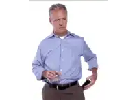 a man in a blue shirt is holding a glass of water in his hand