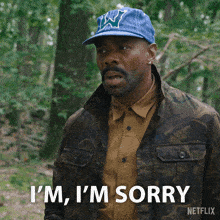 a man wearing a hat that says i 'm sorry