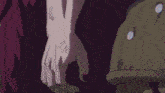 a person is holding a purple lightning bolt in their hand