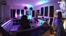 a room with a chair and computer monitors with the words this guy on the bottom right