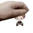 a pixel art of a hand holding a small doll .