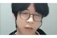 a close up of a person wearing glasses and earphones .