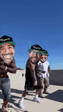 three men wearing hats that say blizzard are dancing