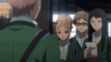 a group of anime characters are standing next to each other and one is holding a piece of paper