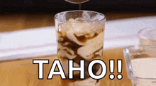 a glass of iced coffee with taho written on the bottom