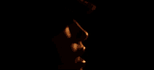 a close up of a woman 's face with her mouth open