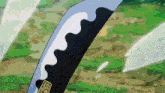 a close up of a sword with a sticker that says ' ec ' on it