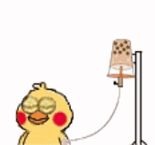 a cartoon duck is sitting next to a lamp with an infusion pump attached to it .