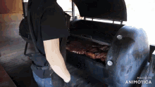 a person is standing in front of a grill that says made in animotica