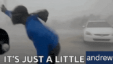 a blurred image of a person and a car with the words it 's just a little andrew