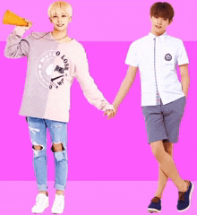 two young men holding hands with one wearing a shirt that says ' o loser ' on it