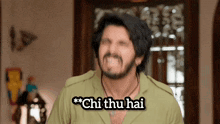 a man with a beard says " chi thu hai " in front of him