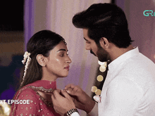 a man is putting a ring on a woman 's finger and the next episode is shown
