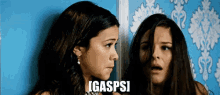 two women are standing next to each other and the word gaspsi is on the bottom