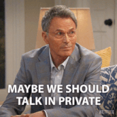 a man in a suit and glasses says maybe we should talk in private on a netflix poster