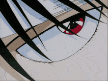 a close up of a person 's eye with red eyes