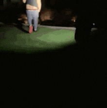 a blurry picture of a person dancing in a dark room