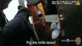 a video of a police officer putting a knife down with the words put the knife down