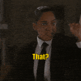 a woman in a suit and tie is saying that