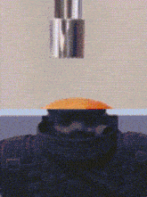 a pixelated image of a man 's head with a bullet coming out of his head