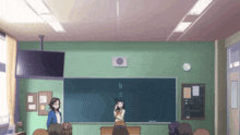 a group of people in a classroom with a blackboard that says " n " on it