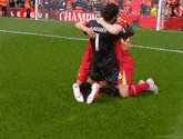 a soccer player with the number 1 on his jersey is hugging another player on the field