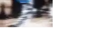 a blurry picture of people walking down a street with a white background .