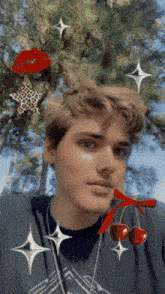 a young man is wearing a black shirt with a cherry on his neck