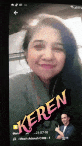 a phone screen shows a woman and the word keren