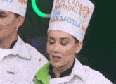 a woman wearing a chef 's hat that says tania on it
